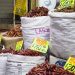 Bags of dried chilies for sale at a market in Mexico City, showcasing a colorful variety.